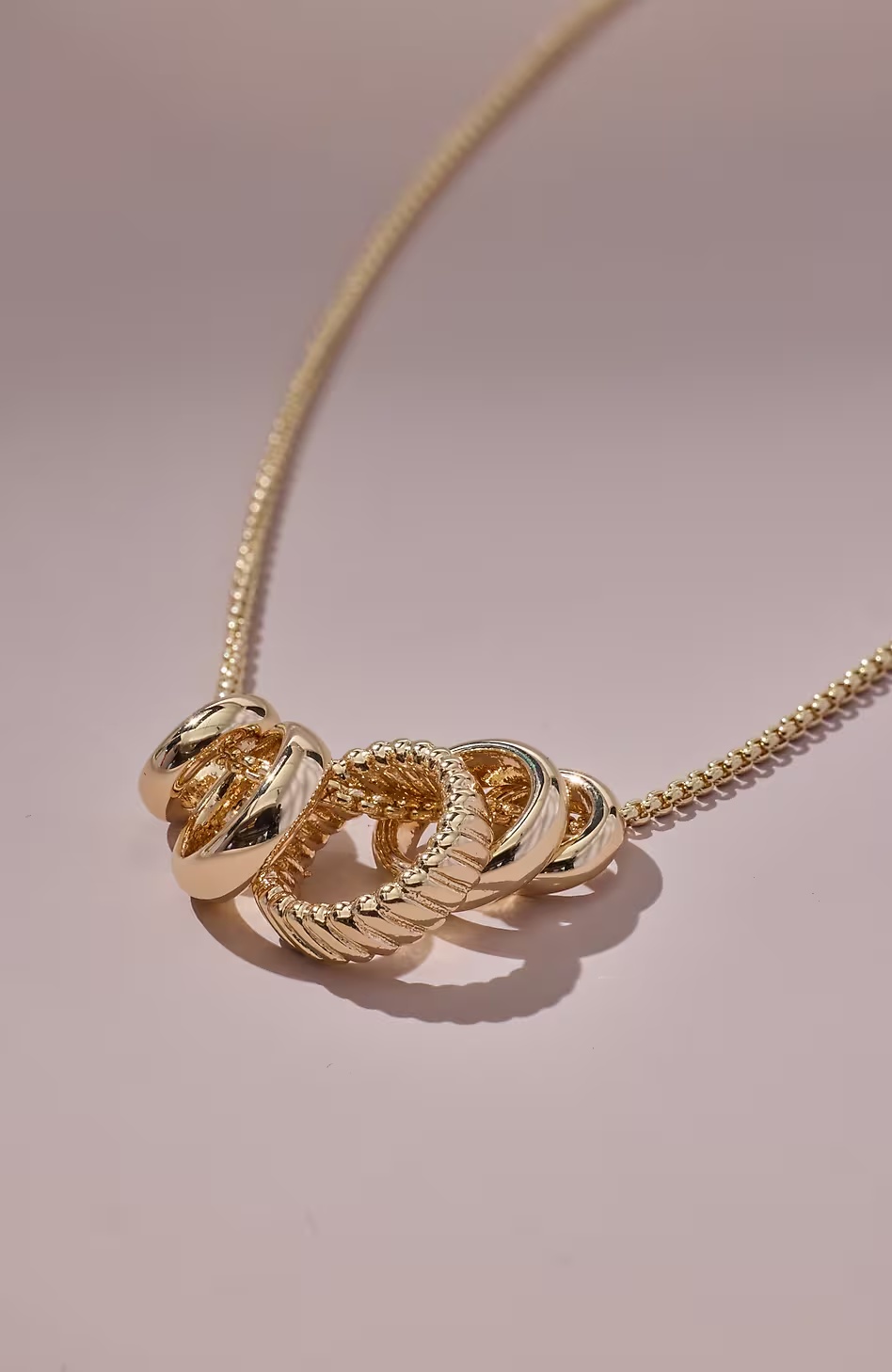 Compassion Fund Five Golden Rings Necklace